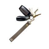 PurseN Wristlet Strap Bronze with keys on white background