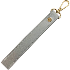 Pearl colored wristlet strap on a white background