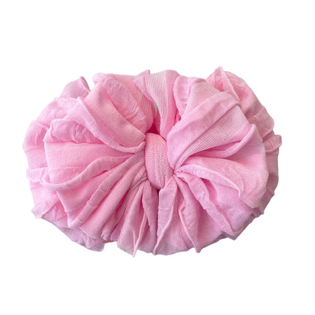 Pink scrunchie on a white background