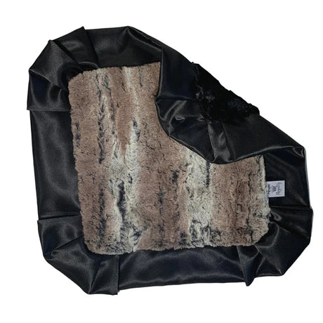 Fur vest with black leather trim on a white background