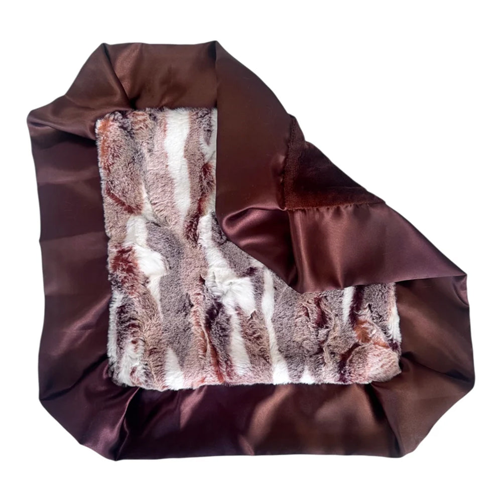 Brown satin bag with fur lining on a white background