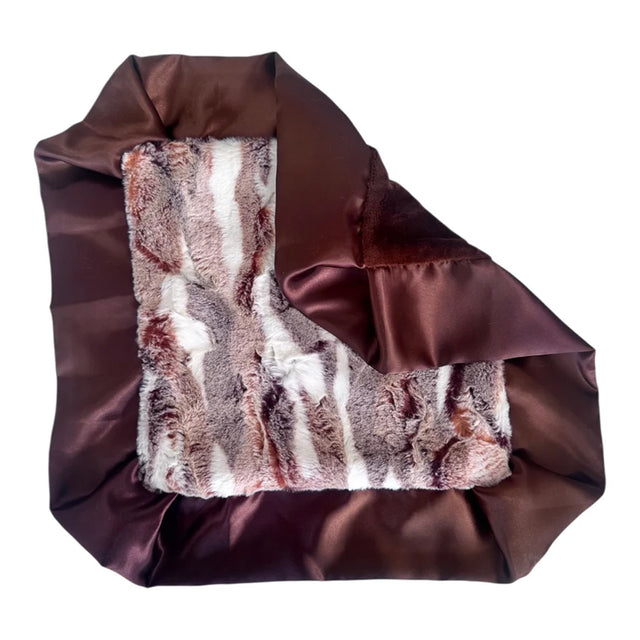 Brown satin bag with fur lining on a white background