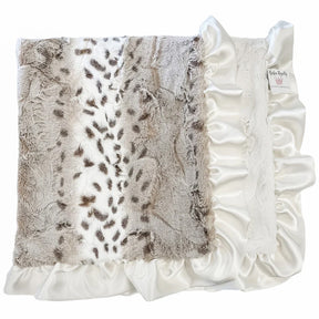 Decorative pillow with faux fur and ruffle trim on a white background