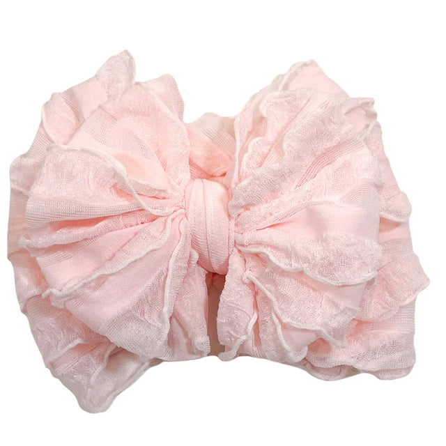Large pink bow on a white background