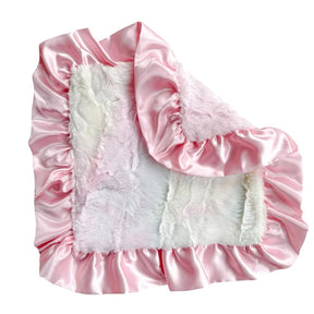 A pink satin blanket with ruffled edges and a soft white faux fur center panel, shown on a plain white background.