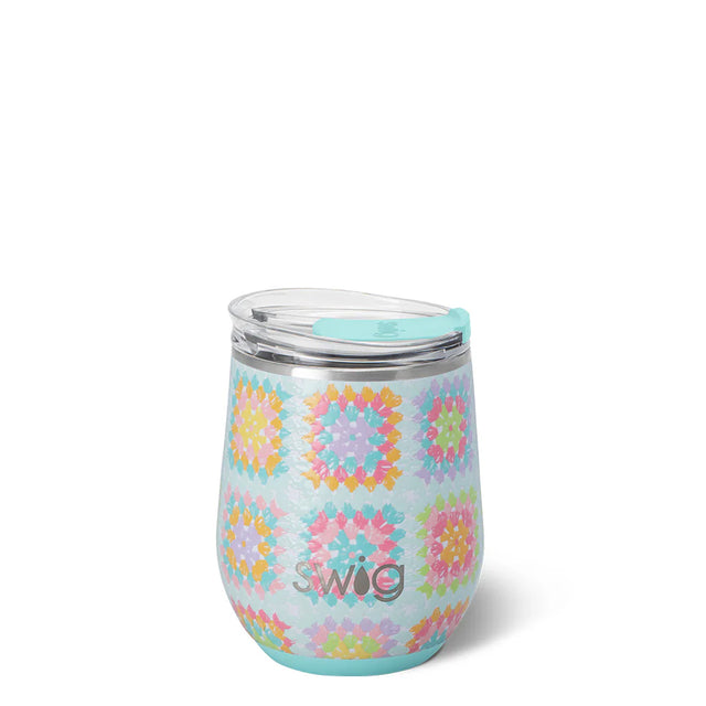 Stainless steel tumbler with colorful geometric pattern on a white background