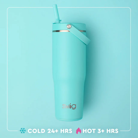 Turquoise swig tumbler with straw on a light blue background