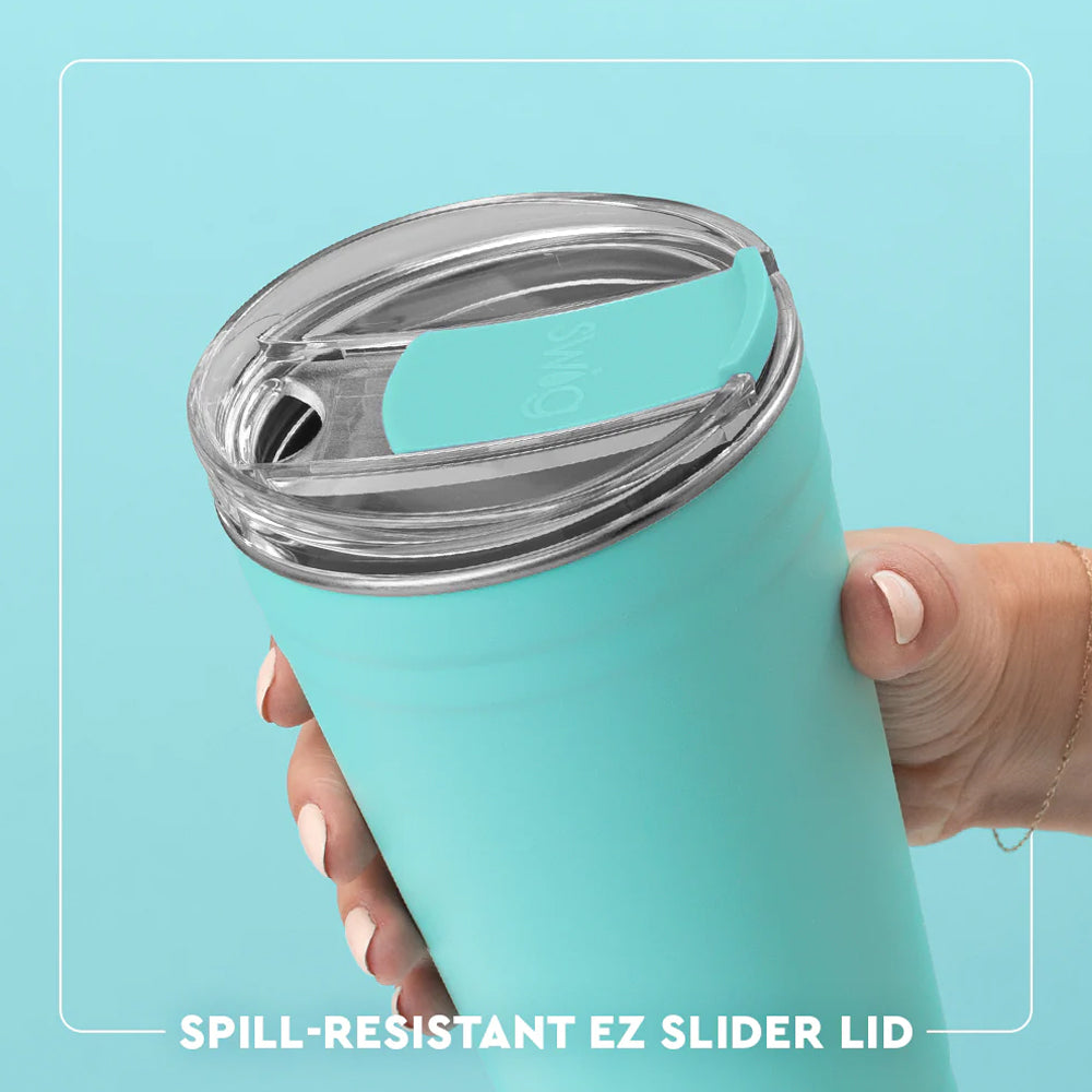 Turquoise tumbler with a spill-resistant EZ slider lid held by a hand against a light blue background.