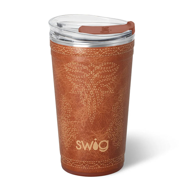 A brown insulated travel tumbler with a clear lid and brown flip-straw cover, featuring a stitched floral pattern and the Swig logo on a white background.