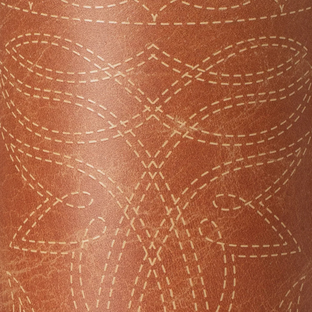 A close-up of a brown leather-like surface with a repeating stitched geometric pattern in a lighter tan color.