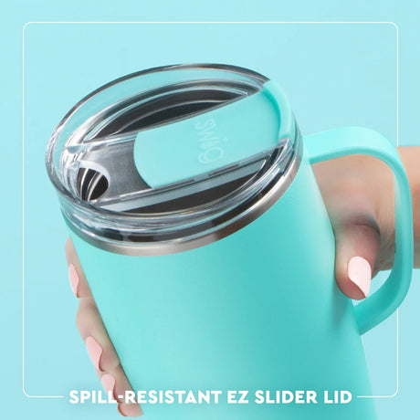 Turquoise tumbler with spill-resistant EZ slider lid held by a hand against a light blue background