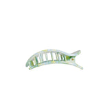 A curved hair claw clip with a marbled pattern of light green, yellow, and white, shown against a plain white background.
