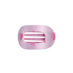 Pink marbled hair clip on a white background