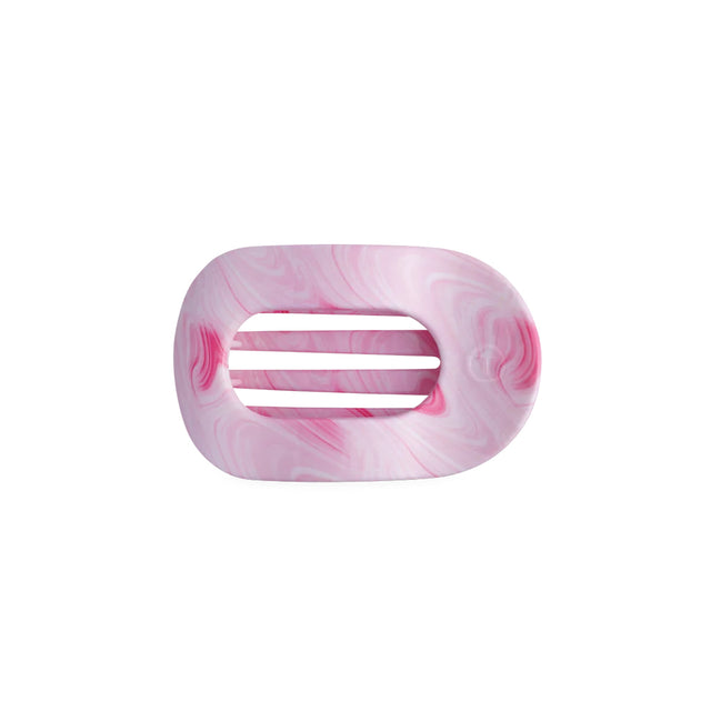 Pink marbled hair clip on a white background
