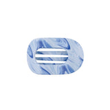 A blue and white marbled resin hair clip with a horizontal center slot, shown on a plain white background.
