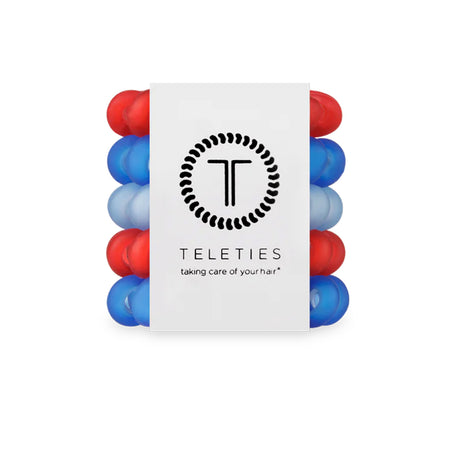 Stack of red and blue hair ties with Teleties branding on a white background