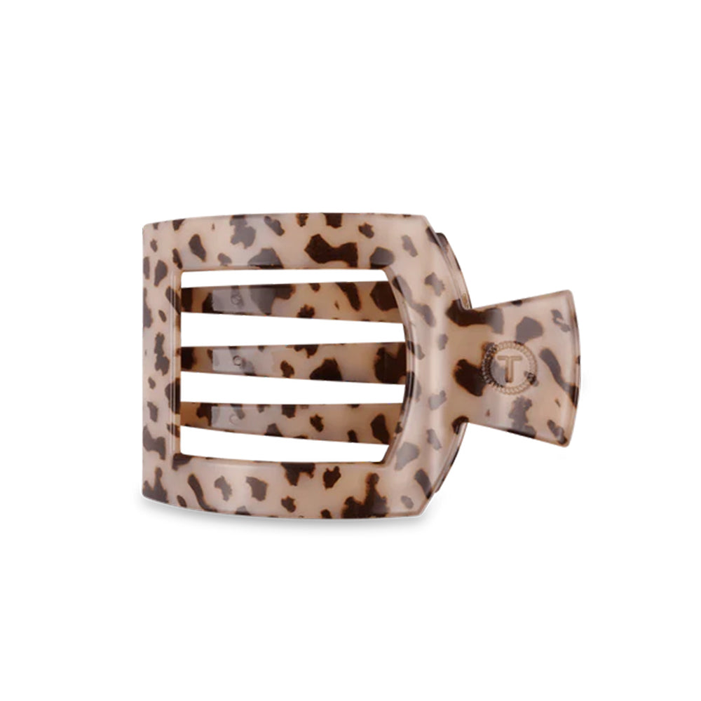 Leopard print hair clip on a white background