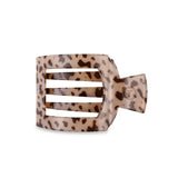 Leopard print hair clip on a white background