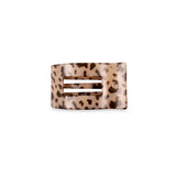 Leopard print hair clip on a white background