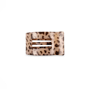 Leopard print hair clip on a white background