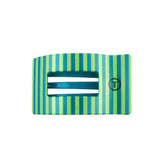 Turquoise hair clip with green accents on a white background