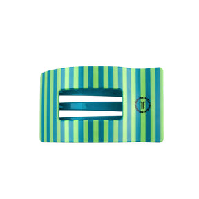 Turquoise hair clip with green accents on a white background