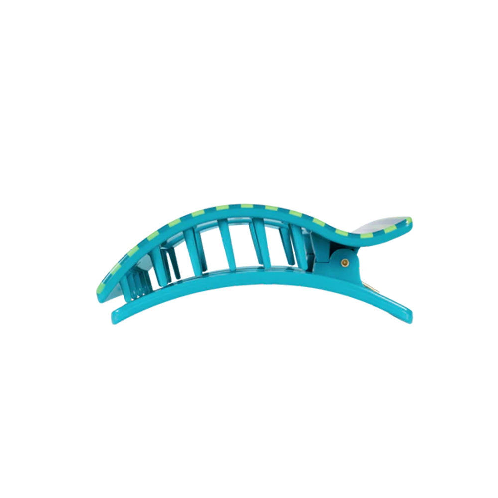 Turquoise hair clip with green accents on a white background