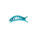 Turquoise hair clip on a white background