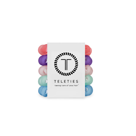 Set of colorful hair ties with a Teleties packaging on a white background