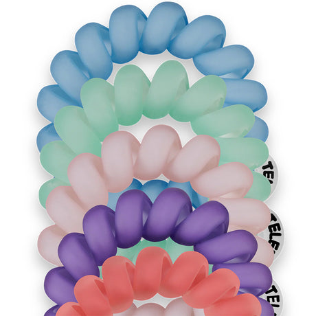 Set of colorful hair ties arranged in a circular pattern on a white background