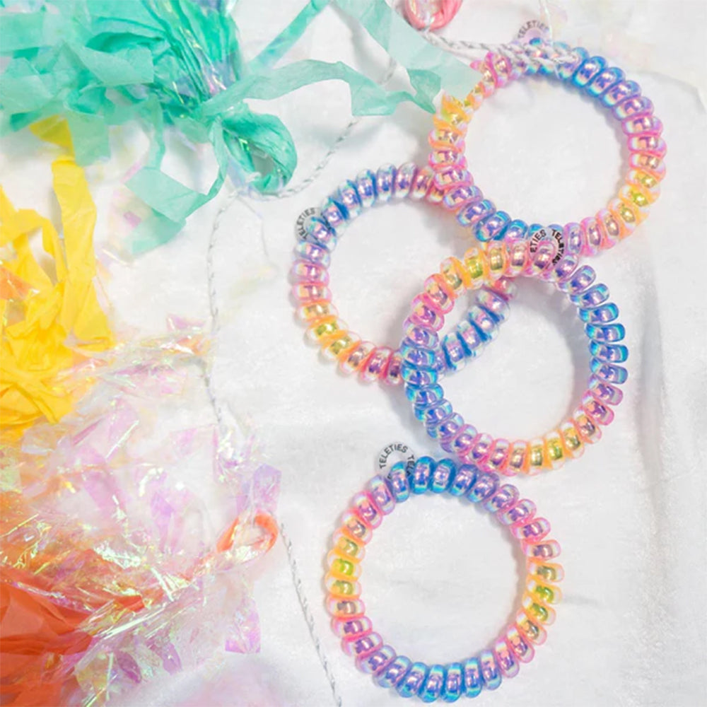Colorful beaded bracelets on a white background with additional colorful items.
