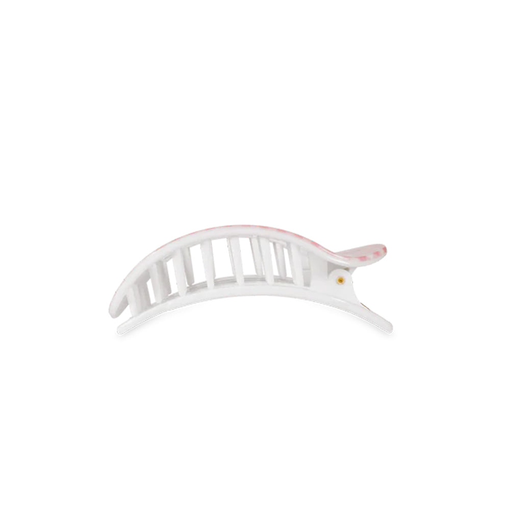 White hair clip with pink accents on a white background