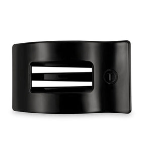 Black hair clip with white stripes on a white background