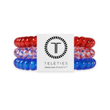 Red, white, and blue hair ties with Teleties packaging on a white background
