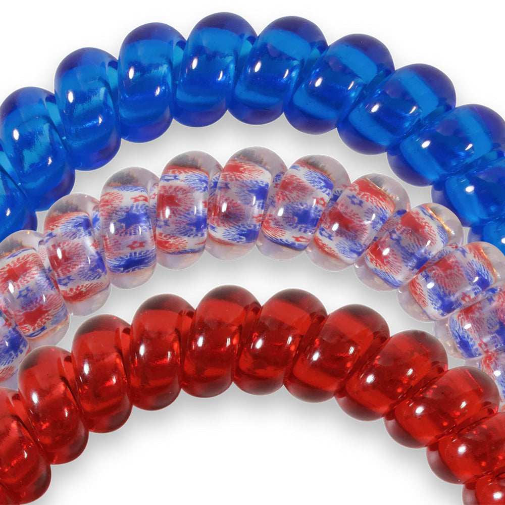 Three hair ties with blue, red, and multicolored beads on a white background