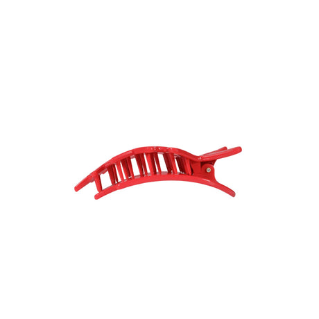 Red star-shaped hair clip on a white background
