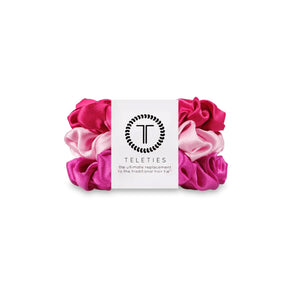 Pink and white scrunchies with a Teleties label on a white background