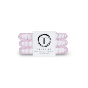 Pink hair ties with a Teleties label on a white background