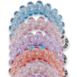 Set of colorful beaded hair ties on a white background