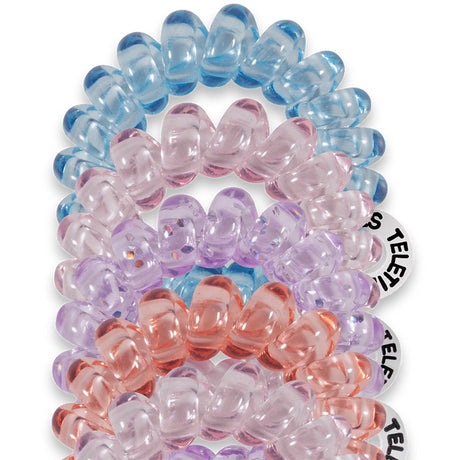 Set of colorful beaded hair ties on a white background