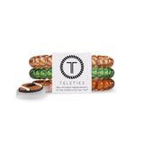 Colorful hair ties in a box with 'Teleties' branding on a white background