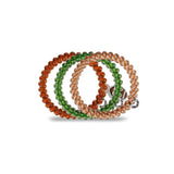 Set of three beaded bracelets in orange, green, and pink on a white background