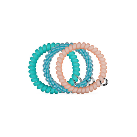 Turquoise hair ties with a brand label on a white background