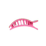 Pink hair clip with green accents on a white background