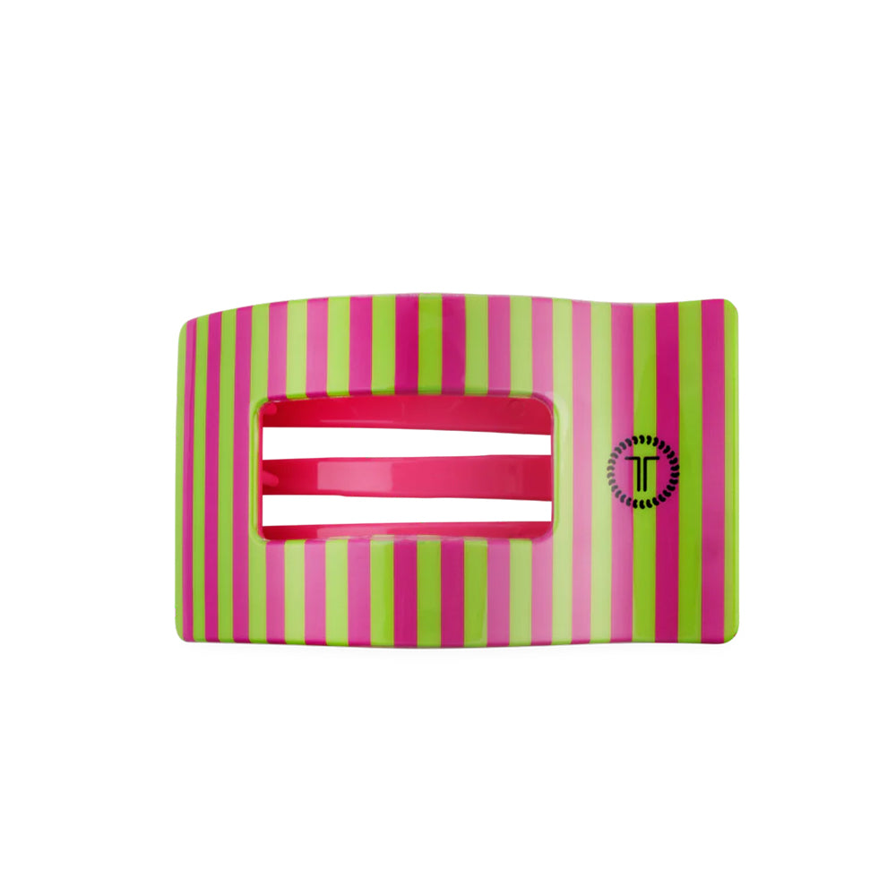 Striped hair clip with pink and green stripes on a white background
