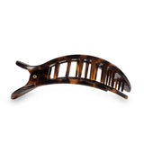 Brown tortoiseshell hair comb on a white background