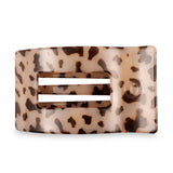 Leopard print hair clip on a white background