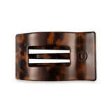 Tortoiseshell hair clip on a white background