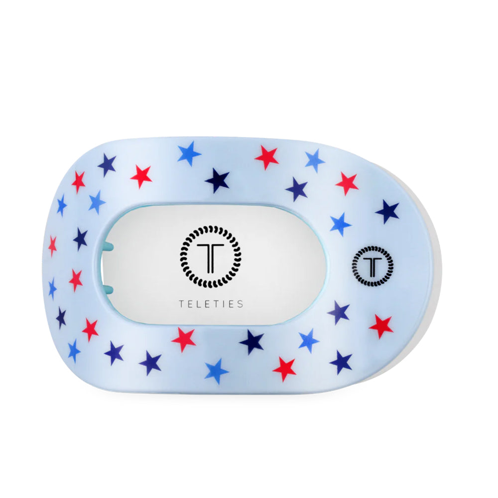 Teleties hair clip with star pattern on a white background