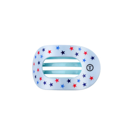 round flat hair clip with star patterns on a white background